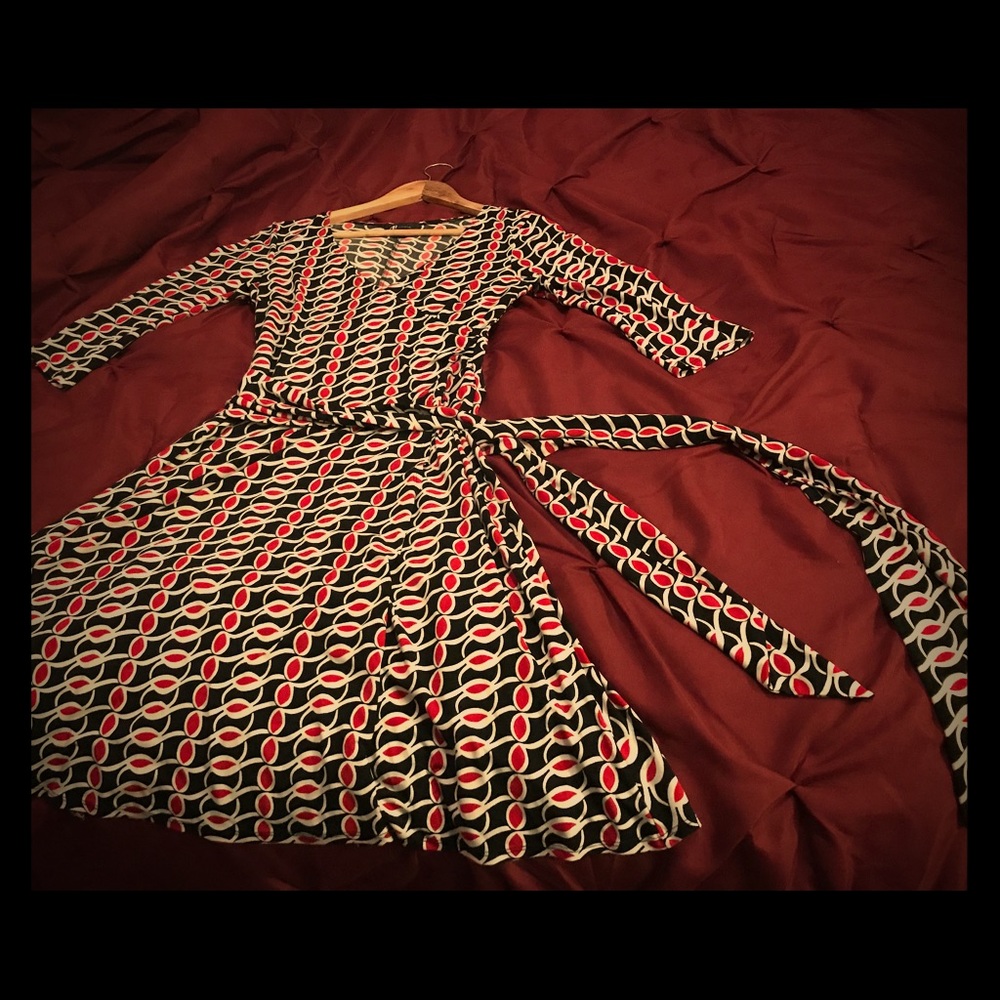 Black white and red long-sleeved wrap dress.